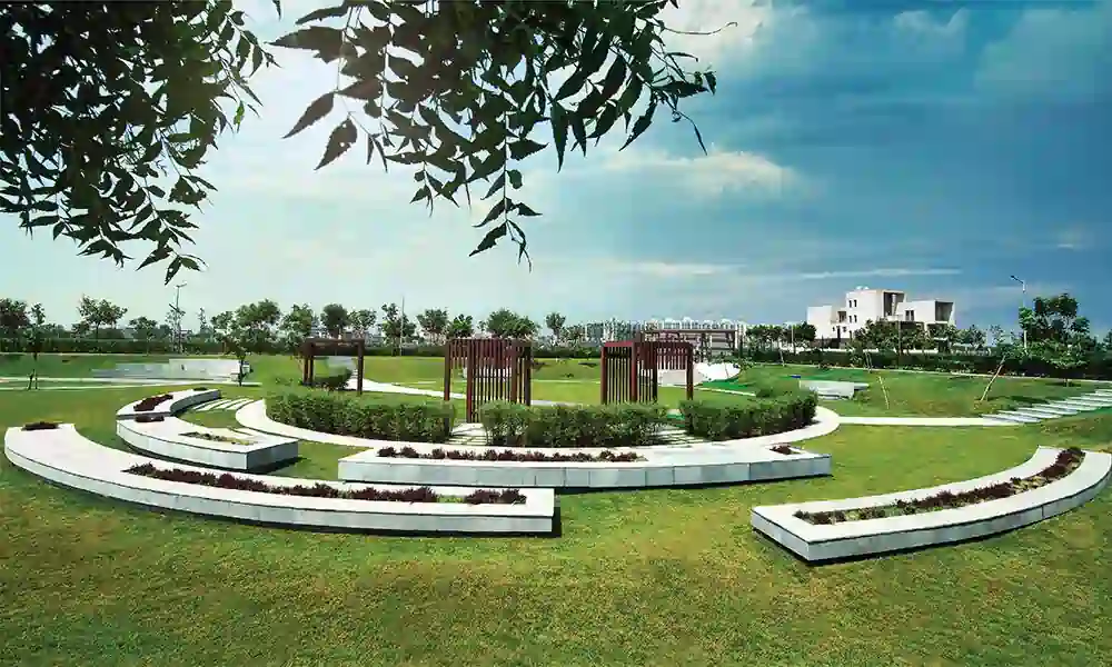 westerlies_gallery4 Experion The Westerlies main entrance view in Gurgaon with lush green landscaping, wide roads, and modern township architecture.