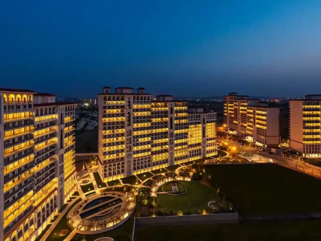 Front view of DLF Privana West in Sector 76, Gurgaon, showcasing luxury residential towers and landscaped open spaces.