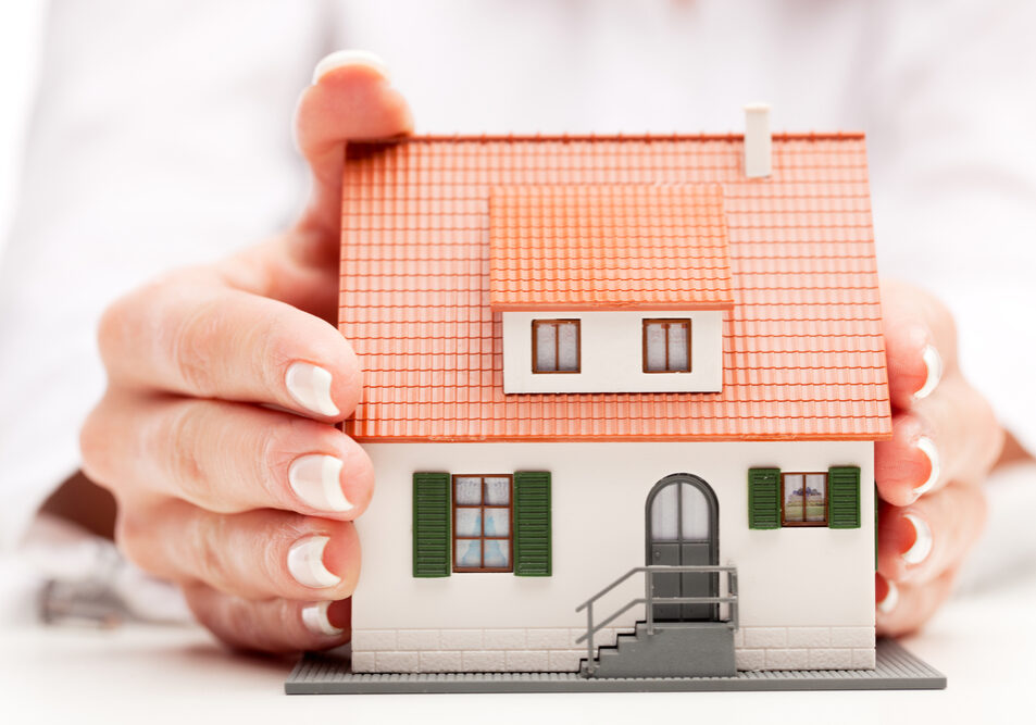 pisture of man and woman hands holding paper house pisture of man and woman hands holding paper house